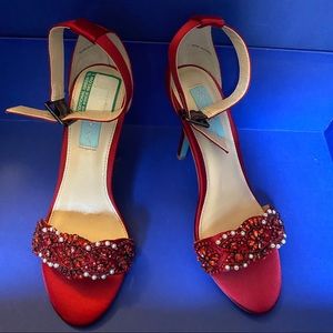 Red heeled sandals with stads